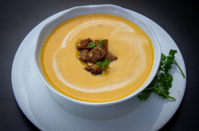 bowl of butternut squash soup on plate
