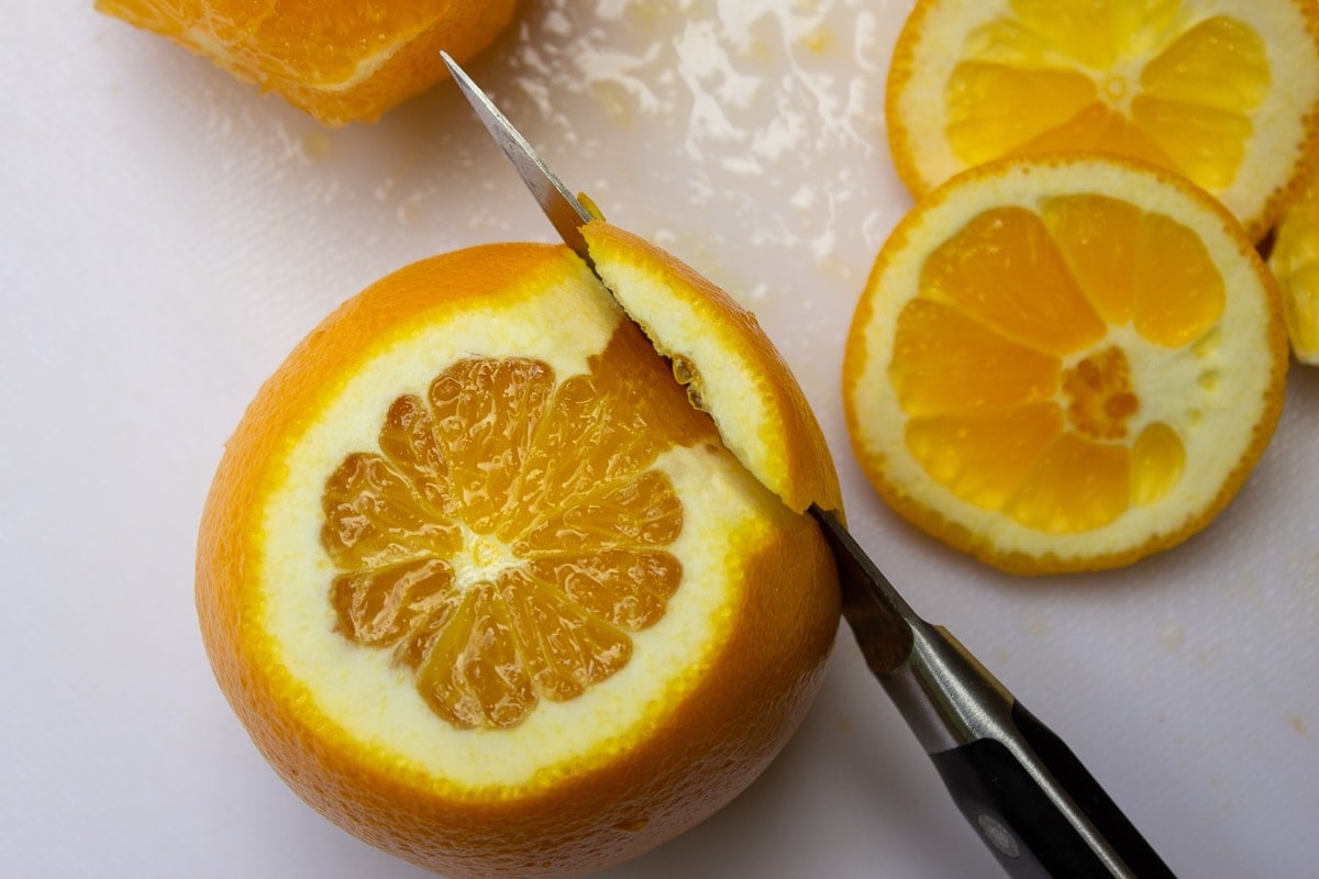 slicing peel off oranges