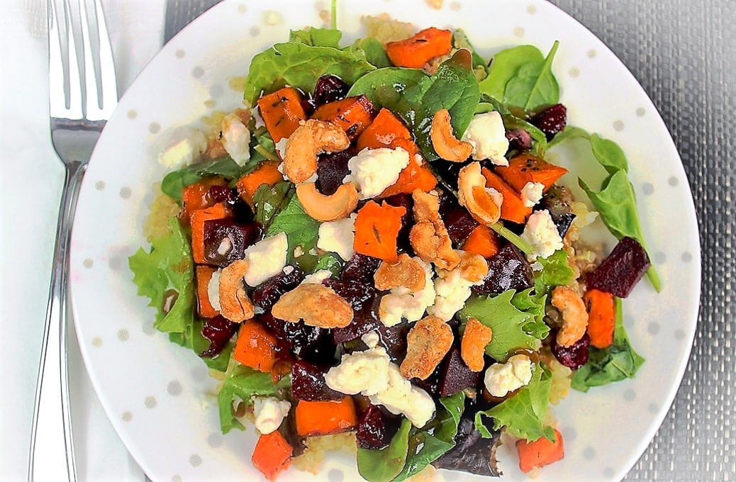 Quinoa sweet potato salad with maple balsamic dressing in bowl
