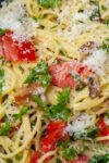 spaghetti carbonara with tomatoes and spinach in bowl p4