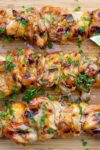 3 honey lime chicken skewers on cutting board p