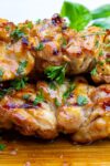 honey lime chicken skewers stacked on cutting board p