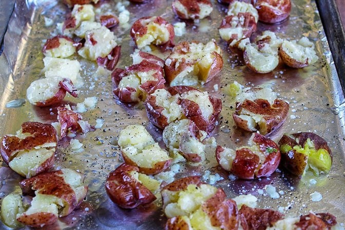 boiled red baby potatoes smashed on pan