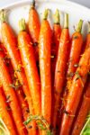 roasted honey glazed carrots on plate with orange zest p1