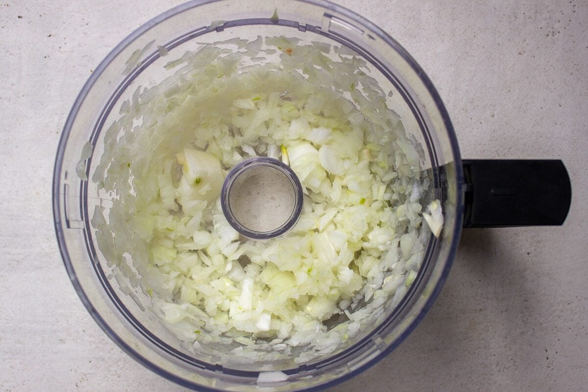 chopped onions in food processor bowl
