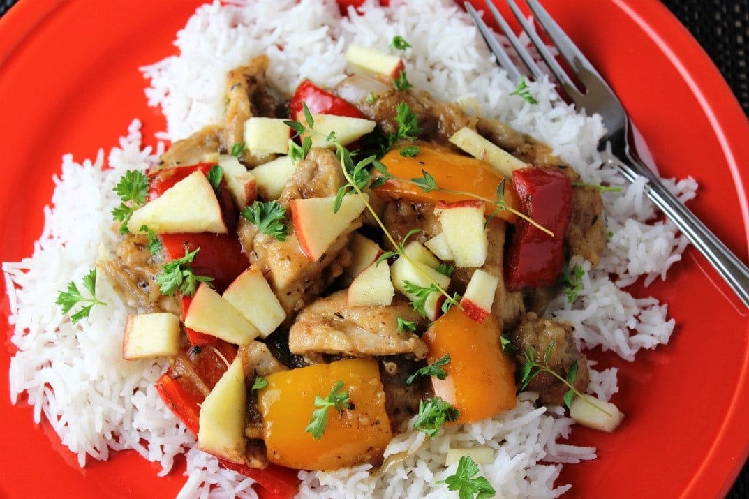 chicken stir fry with apples over rice on plate 2