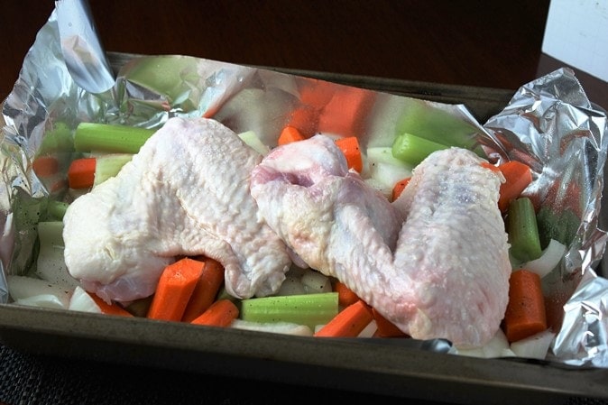 Roasting turkey wings and vegetables to make broth