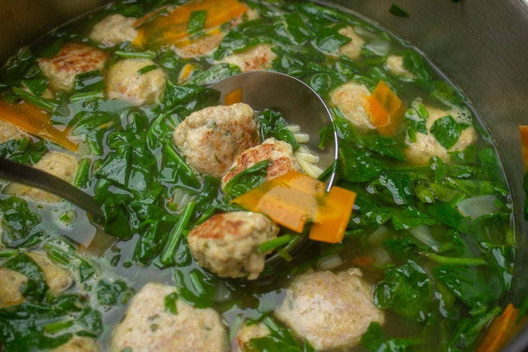 wedding soup in pot with ladle