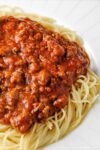 spaghetti and meat sauce in a bowl p