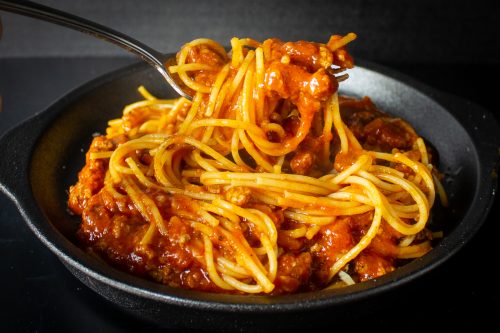 spaghetti and meat sauce on a plate f