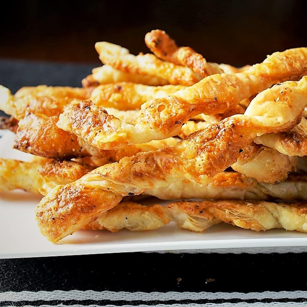 cheese twists on plate in pile