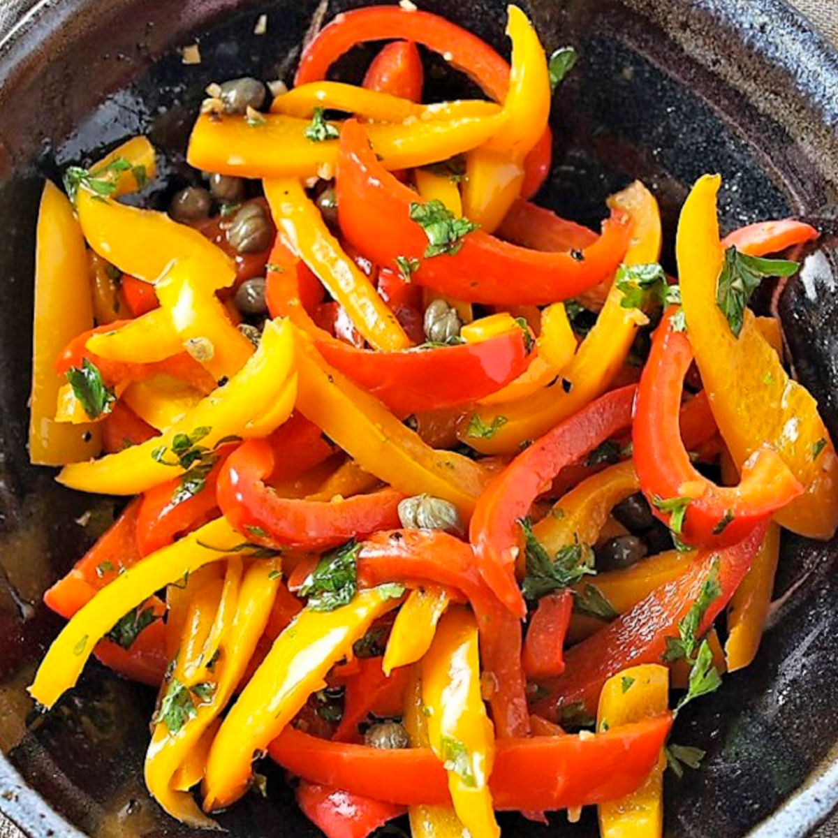 bowl of sauteed peppers with caper vinaigrette