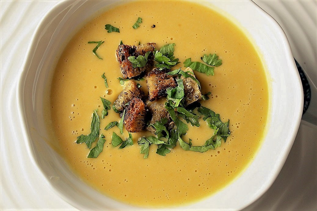 Thai-inspired butternut squash soup in bowl with garnish 4