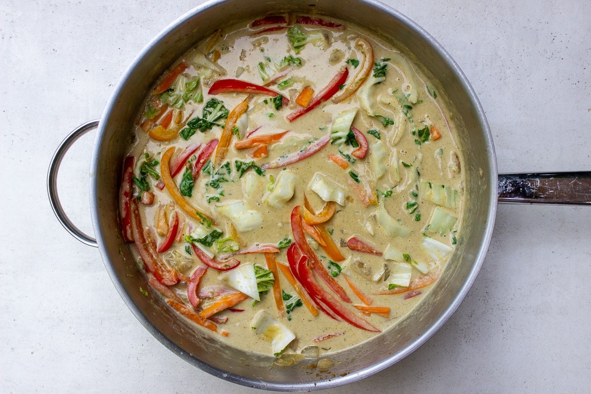 curry sauce and veggies in pan