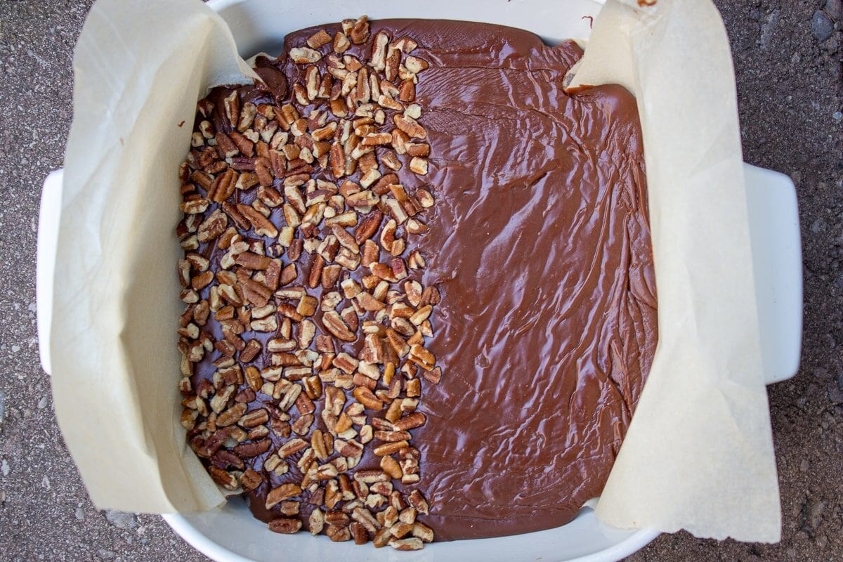 chocolate fudge mixture in parchment lined pan
