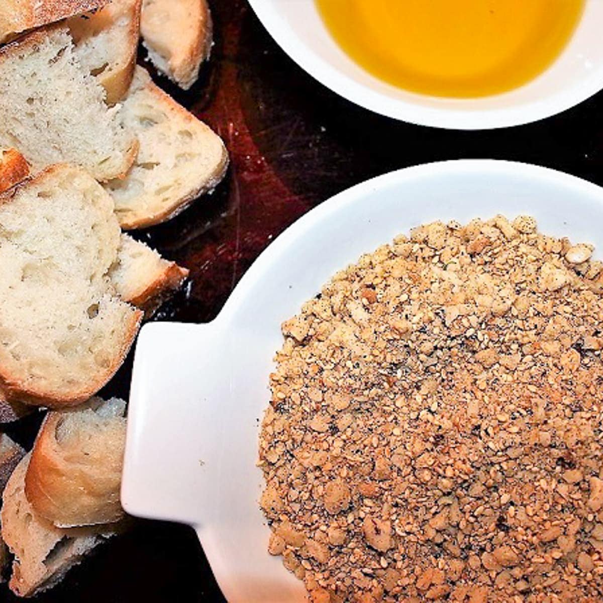 dish of dukkah, bread and dish of oil