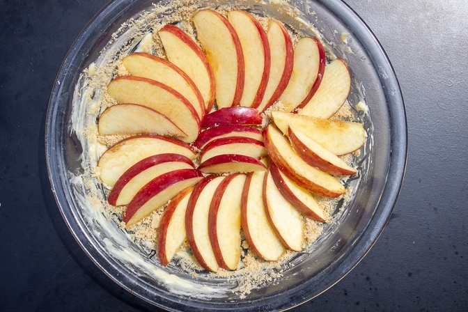 apple slices fanned out in pie dish