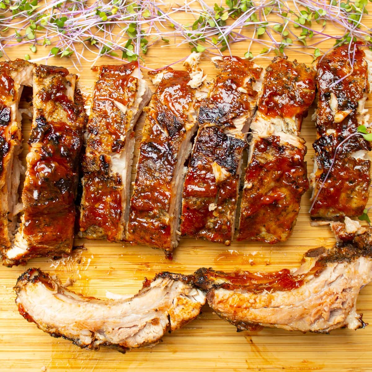 sous vide baby back ribs with a sweet tangy BBQ sauce. mouthwatering.