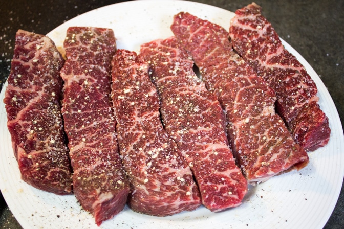 raw boneless beef short ribs on a plate