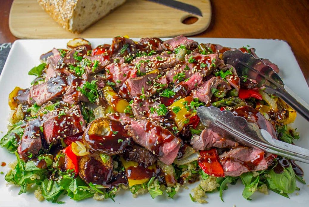 sous vide steak on salad with roasted vegetables