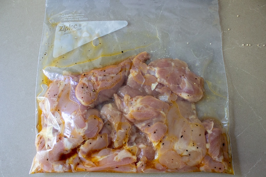 chicken marinating in sealed bag