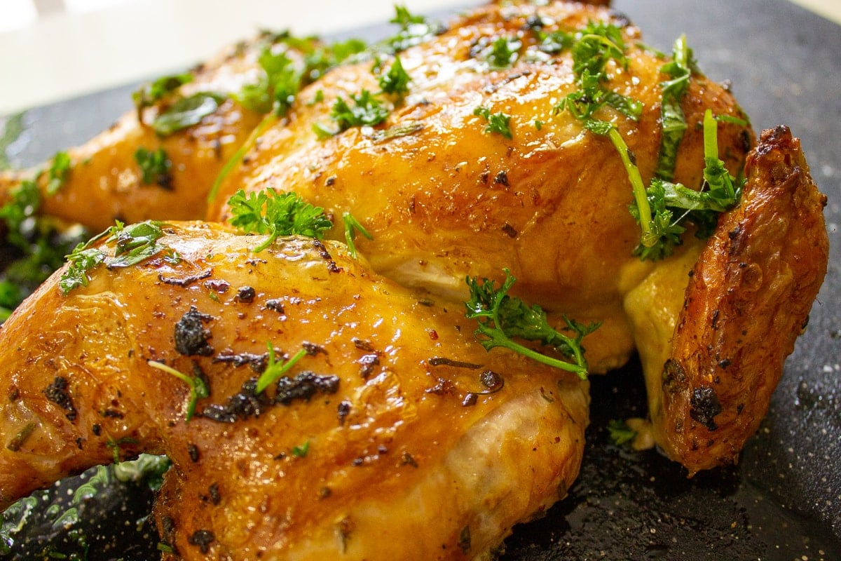 cedar plank chicken on cutting board