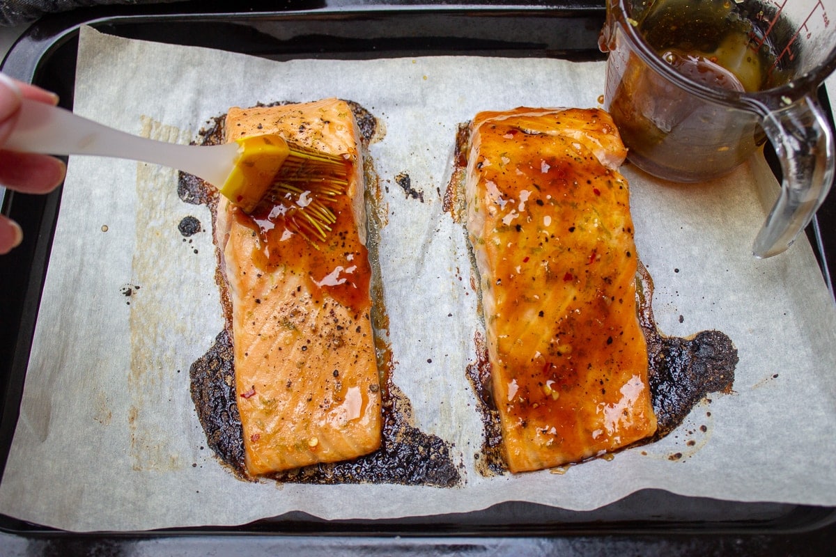 baked salmon filets on pan with glaze
