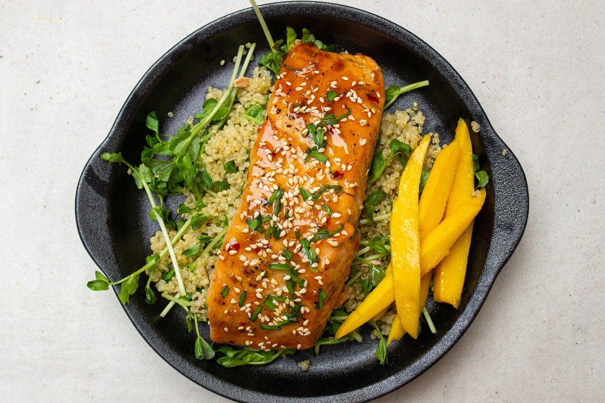 salmon filet over quinoa on plate