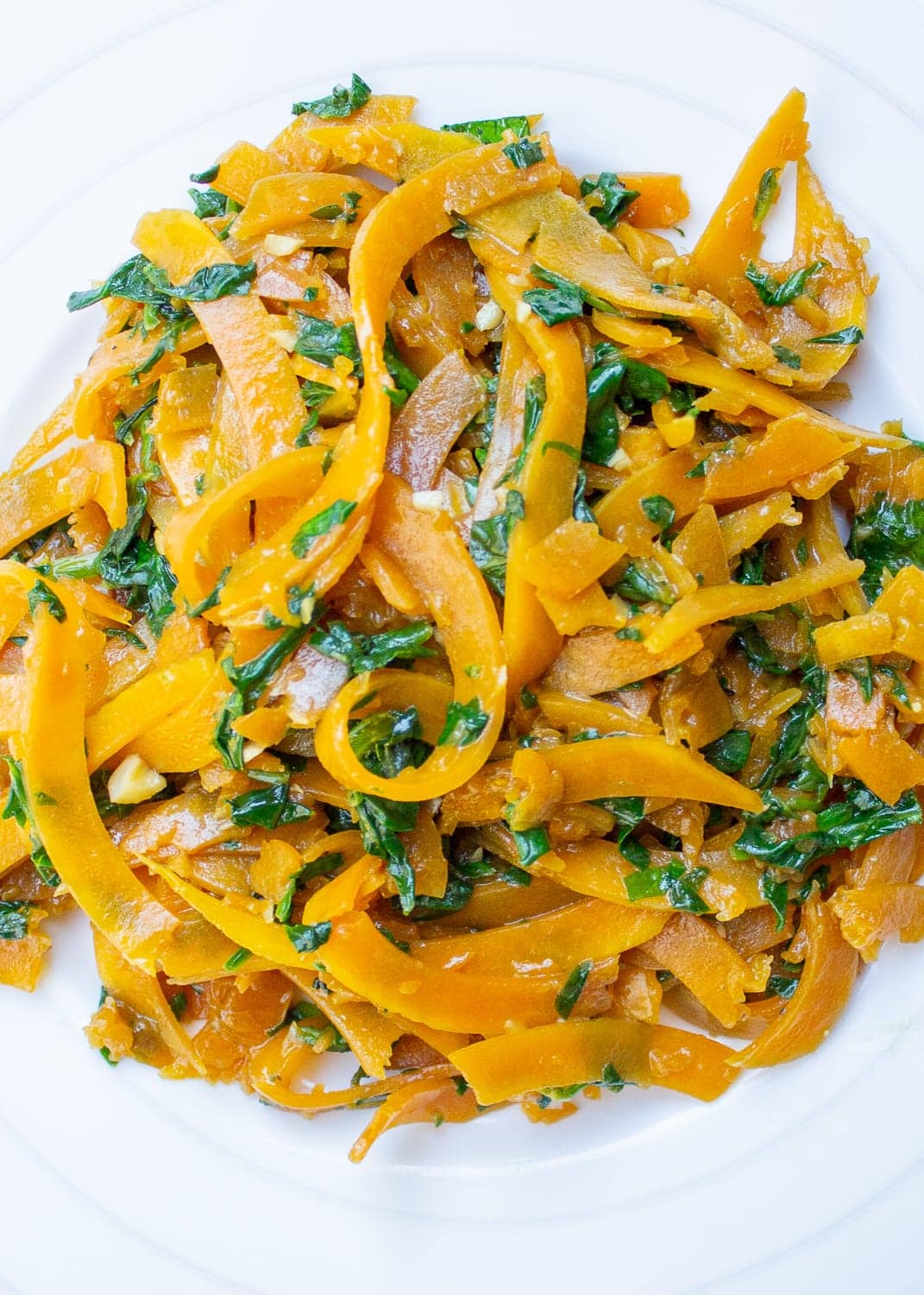 plate of sauteed butternut squash noodles with spinach p