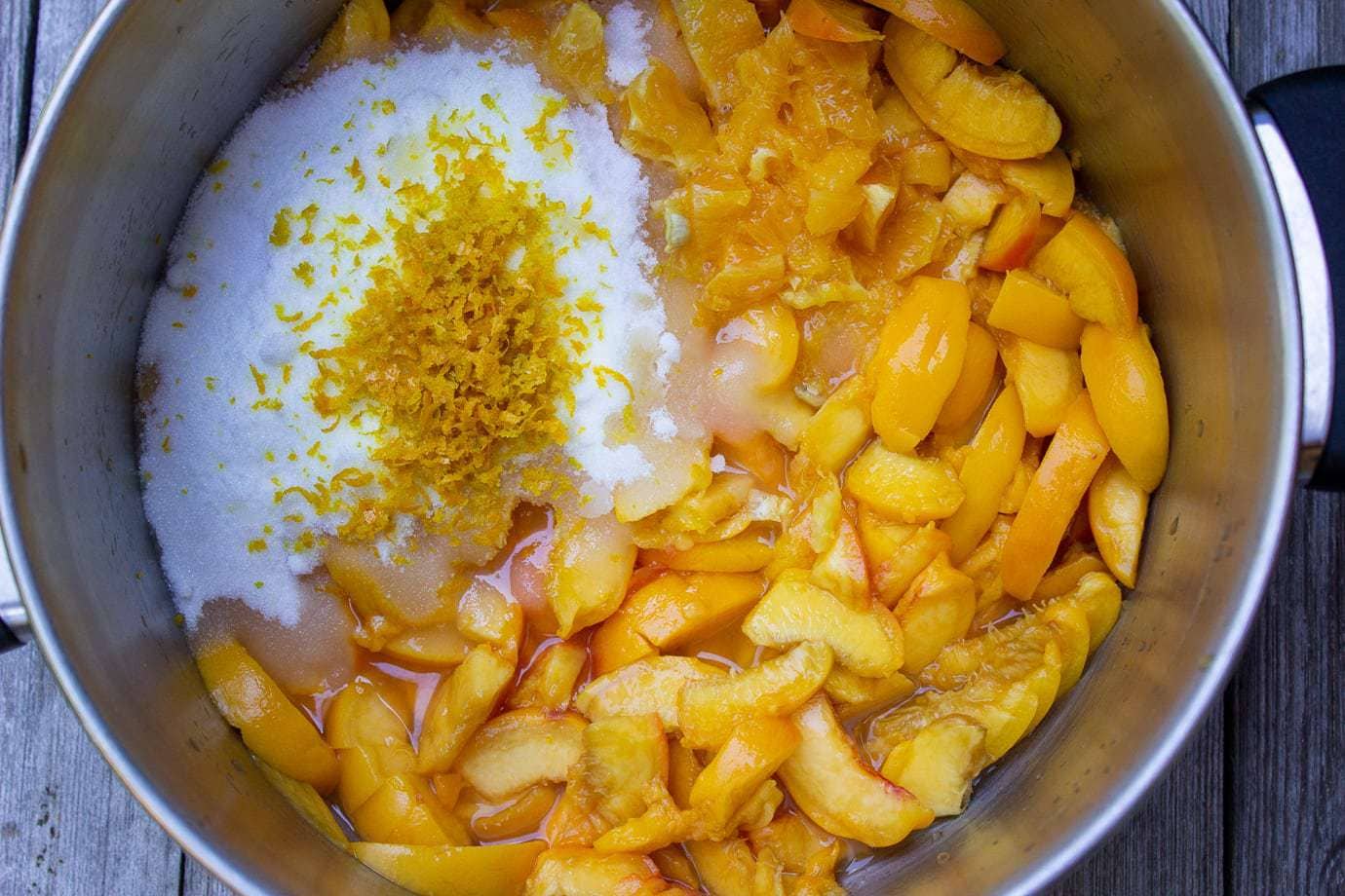 chopped peeled peaches, sugar orange zest and lemon in a pot