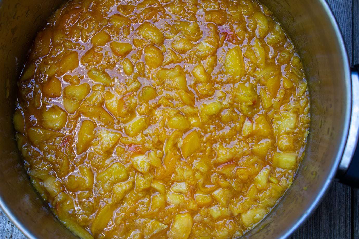 peach marmalade ingredients mixed in pot ready to cook