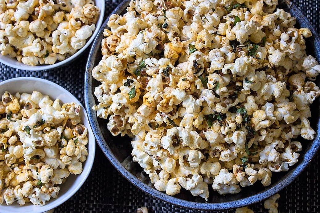 Spiced herb popcorn with smoked paprika, lemon zest, garlic and fresh herbs. Addictive!
