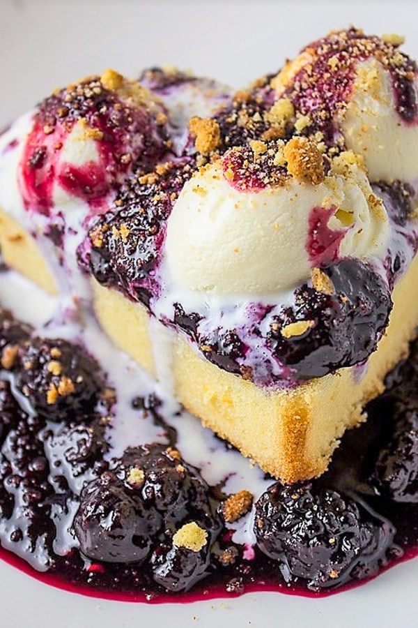 pound cake with berry sauce in bowl with ice cream