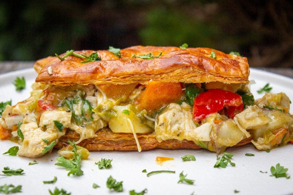 pot pie filling sandwiched between puff pastry crusts