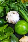Thai Green Curry Paste ingredients of garlic lime, cilantro, kaffir leaves, jalapeno, green onion