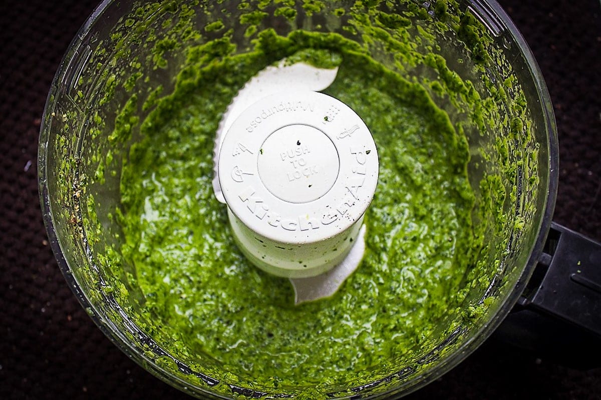 pureed green curry paste in food processor bowl