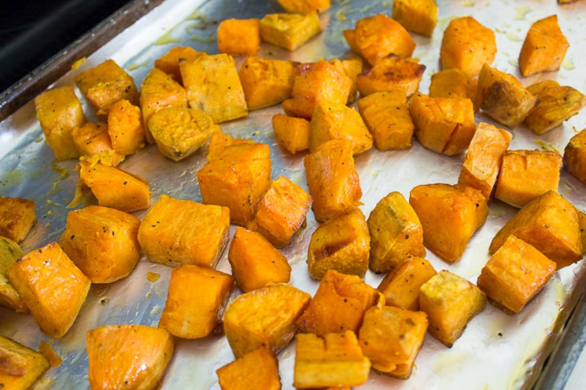 roasted cubed sweet potatoes on pan