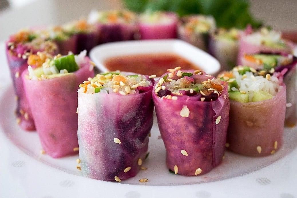 Summer Vegetable rice paper Rolls cut on plate with dip 