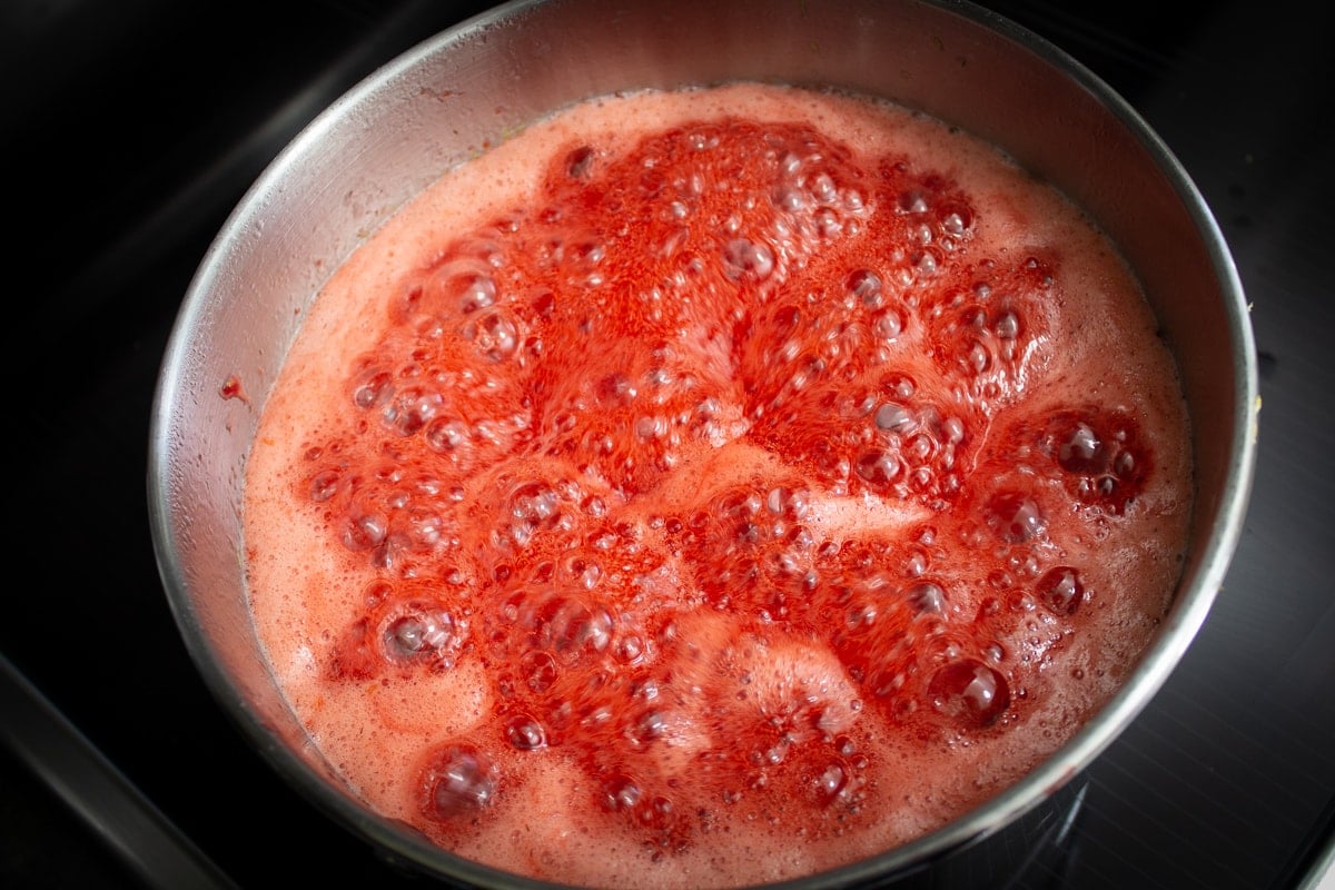 strawberry jam boiling in pot