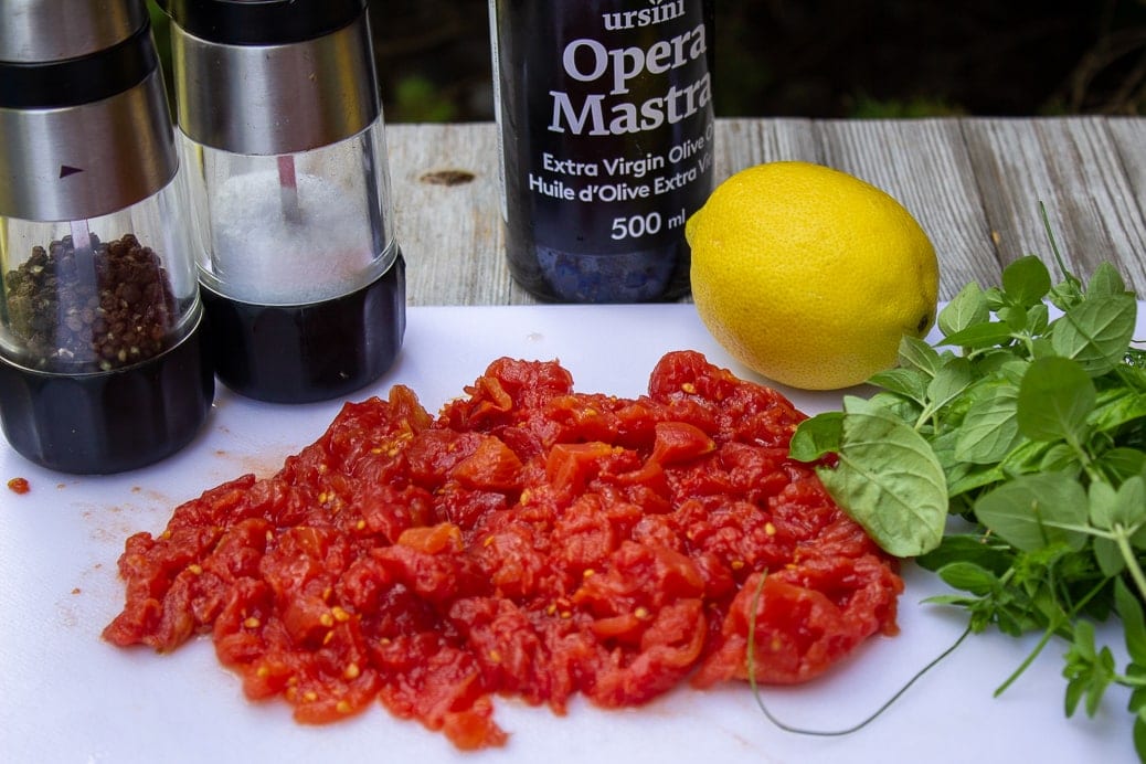 chopped tomatoes, salt, pepper, olive oil, lemon, herbs
