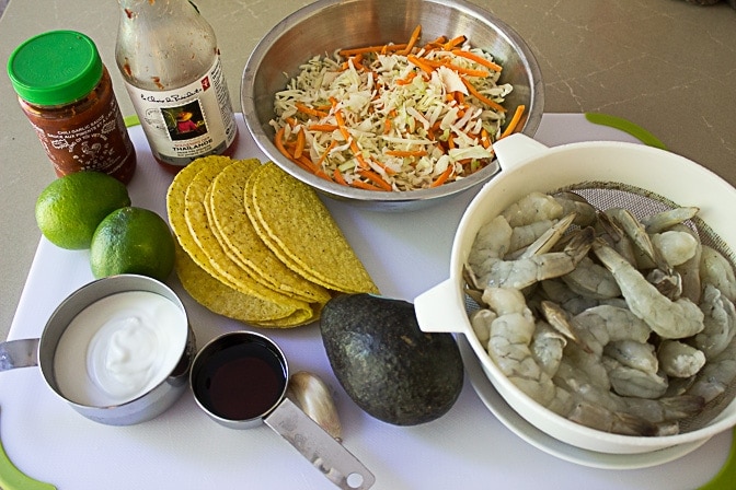 shrimp, tacos, slaw, chili sauce, avocado, lime,