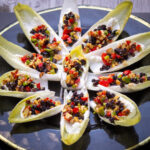 endives with goat cheese and garnish on plate