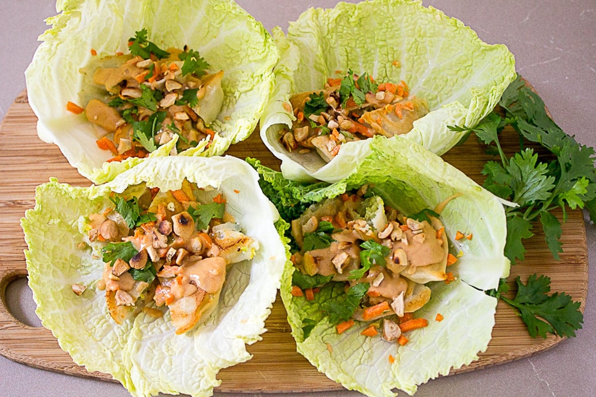 lettuce wraps with dumplings on cutting board 1