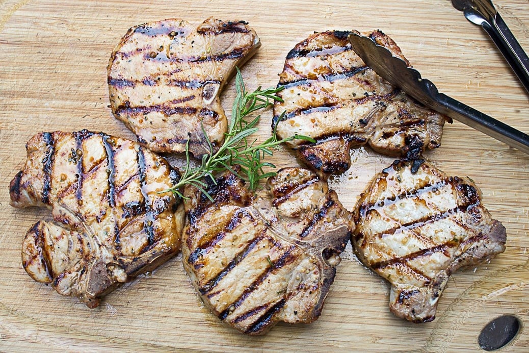 grilled pork chops on cutting board 2