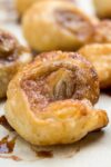 mini cinnamon puff pastry roll on plate 1