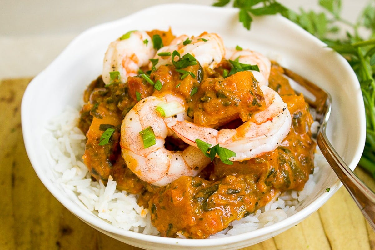 squash curry with shrimp over rice in bowl p