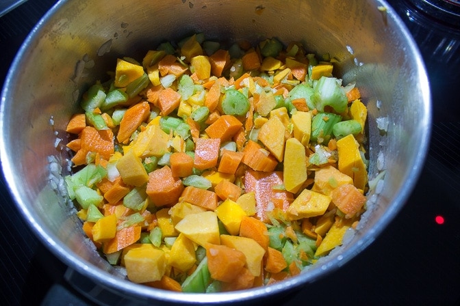 chopped vegetables sauteing in pot