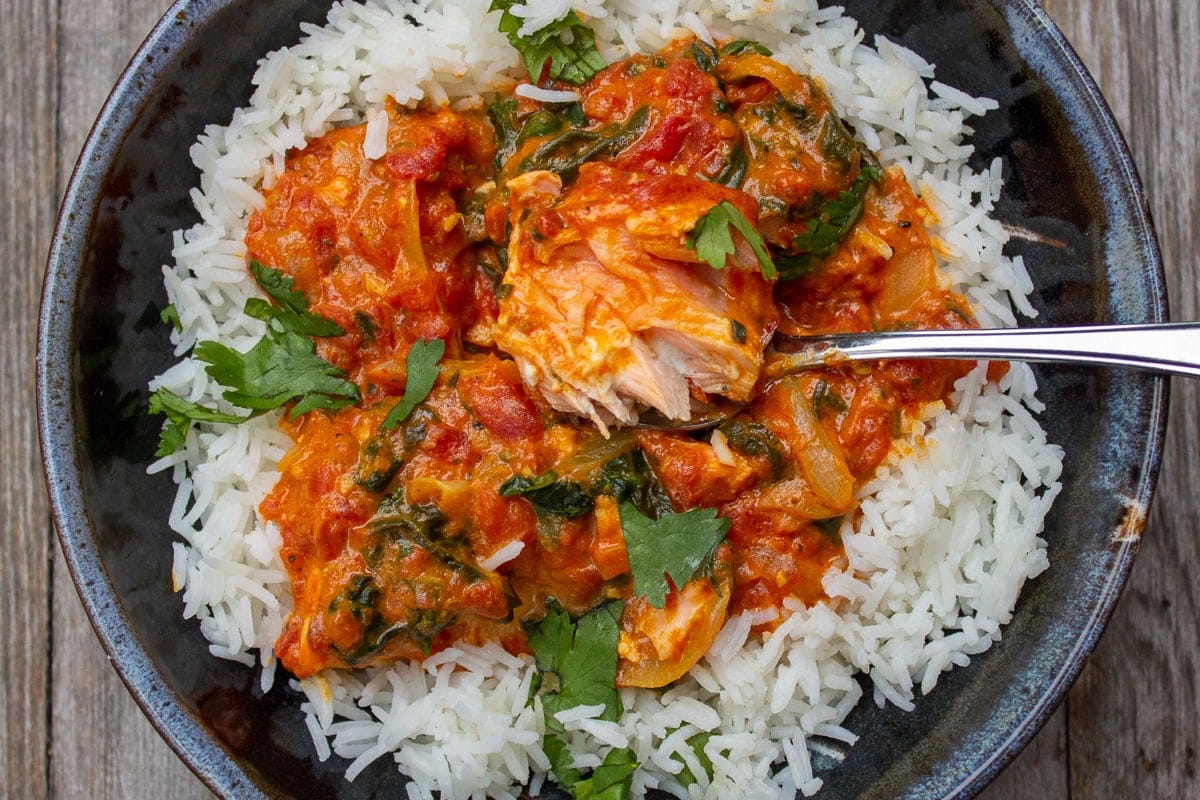 Coconut Curry Salmon over rice in a bowl ff