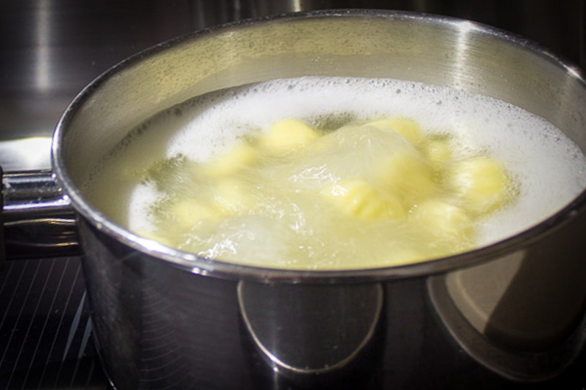gnocchi boiling over pot