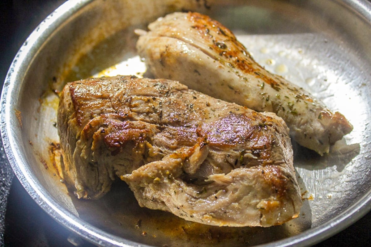 seared pork tenderloin in pan